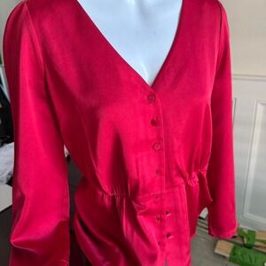 J.Crew red satin blouse with button-up front, long sleeves,‎ and ruffle hem